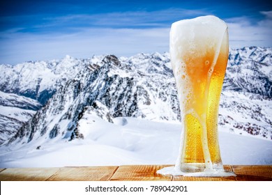 Winter Beer And Landscape Of Alps 