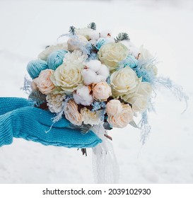 Winter Bouquet On The Background Of Mittens