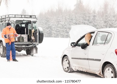 Winter car assistance man help woman breakdown snow road problem
