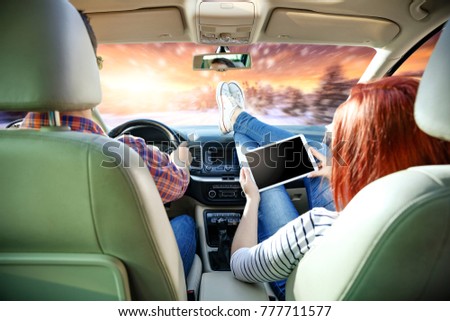 Similar – young women enjoying vacation in the car on road trip