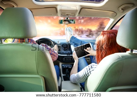 Similar – young women enjoying vacation in the car on road trip