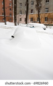Winter. Cars under snow