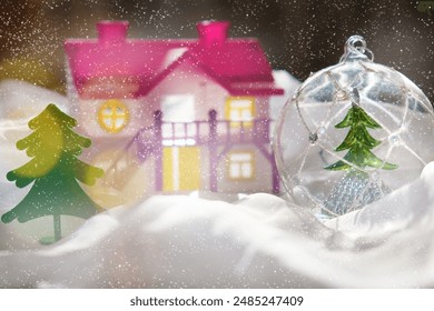 Winter and Christmas concept. Snow globe, doll house and fairy magic atmosphere, golden bokeh - Powered by Shutterstock