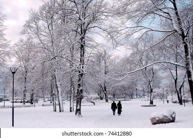 Winter In City Park. Couple In Winter Park.