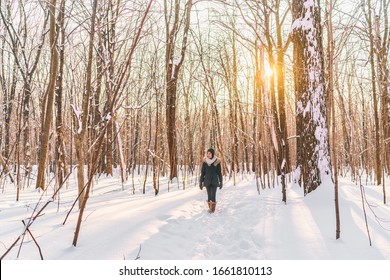 Winter city park outdoor walk woman walking in snow in snowy forest path in sunny day, active people. Outside leisure. girl hiking in nature. - Powered by Shutterstock