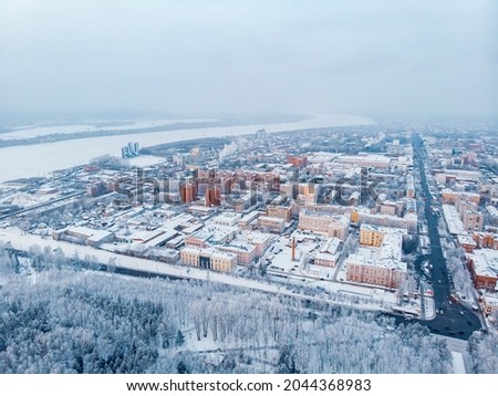 Winter cityscape Tomsk Siberia snow forest, Russia aerial top view.