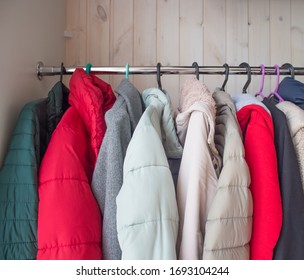 Winter Clothes In A Closet On A Coat Hanger. Cleaning Winter Clothes Until Next Season