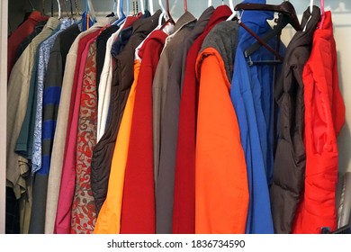 Winter Coats And Clothes That Do Not Fit Anymore Hanging In A Clothes Closet