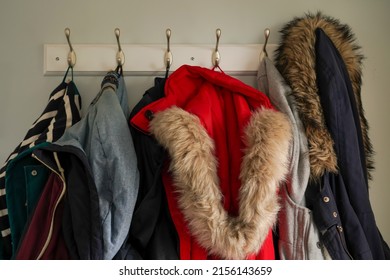 Winter coats hanging on hooks - Powered by Shutterstock