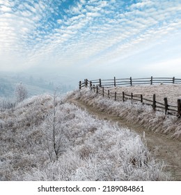 Winter coming. Last days of autumn, morning in mountain countryside peaceful picturesque hoarfrosted scene. Dirty road from hills to the village. Ukraine, Carpathian mountains. - Shutterstock ID 2189084861