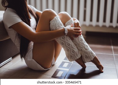 Winter Concept Image Of Young Girl,working At Home,stylish Girl In Socks Sits Sofa,floor,warm Vintage Colors