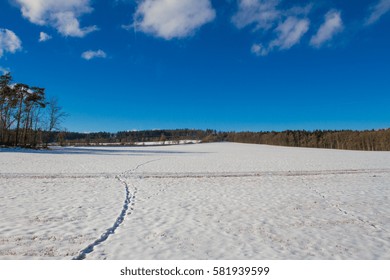 Winter countryside with steps in snow.