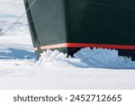 Winter cruise vacation concept. Cruise ship breaking through the ice.