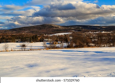 Winter Daytime Scene With Snow, Mountains, Clouds, Trees And Fields. Seated In Hudson Valley, Brunswick NY Outside Of Albany.