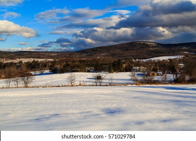 Winter Daytime Scene With Snow, Mountains, Clouds, Trees And Fields. Seated In Hudson Valley, Brunswick NY Outside Of Albany.