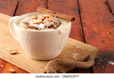 winter drink, Sahlab with milk and cinnamon on wooden background 
