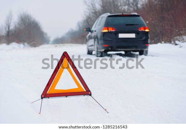 Winter driving - car breakdown Car breakdown on a\
country road in winter.