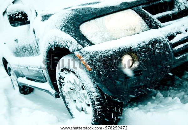 Winter driving conditions. Snow storm,
snow tires,driving hazards and weather
concept.
