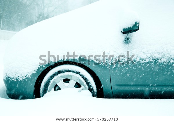 Winter driving conditions. Snow storm,\
snow tires,driving hazards and weather\
concept.
