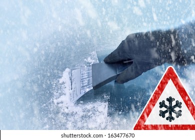 Winter Driving - Scraping Ice From A Windshield With Traffic Sign