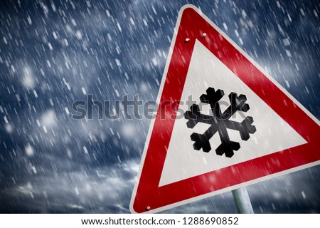 winter driving - warning sign - risk of snow and ice 