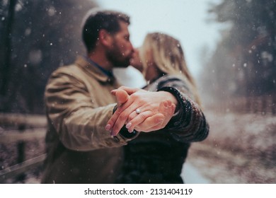 winter engagement in a snowstorm - Powered by Shutterstock