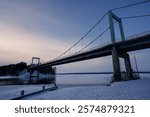 Winter evening view of Karisalmi Bridge in Asikkala, Finland