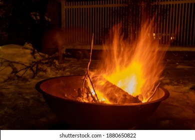 Winter Fire In The Outdoor Fire Pit In The Snow