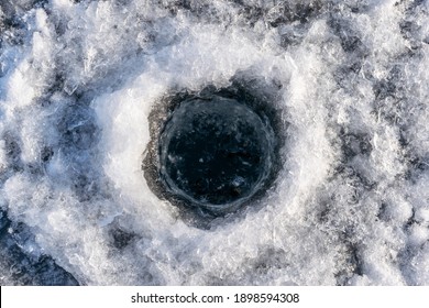 Winter Fishing Hole In The Ice