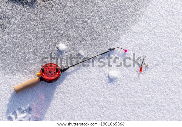 Winter fishing rod on the\
ice