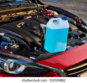 Winter Fluid Refilling In Car. Winter Service For Safe Driving.