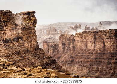 Winter Fog Wafts Through Chesler Park in Canyonlands' Needles District - Shutterstock ID 2276333875