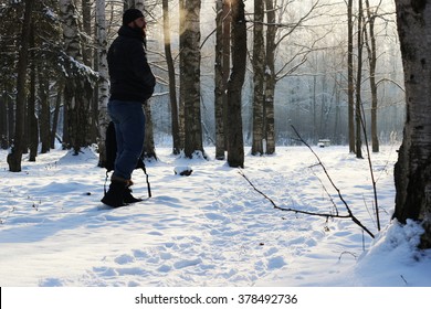 Winter forest man footpath