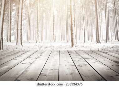 Winter Forest With Trees Covered Snow With Wood Planks Floor