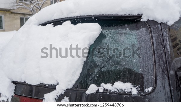Winter frozen back car window, texture\
freezing ice glass\
background