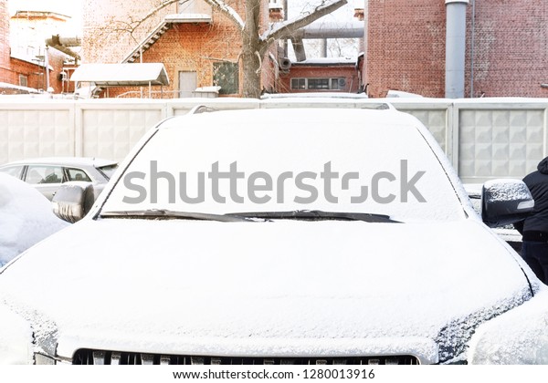 Winter frozen back car window, texture\
freezing ice glass\
background