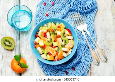 Winter Fruit Salad On Wood Background. Toning. Selective Focus