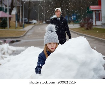 Winter Fun. Cheerful Child In A Hat Plays Snowballs 2020