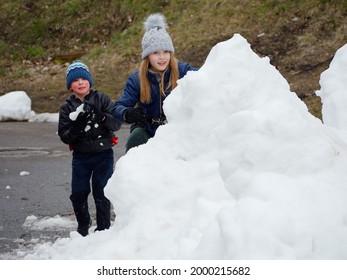 Winter Fun. Cheerful Child In A Hat Plays Snowballs 2020