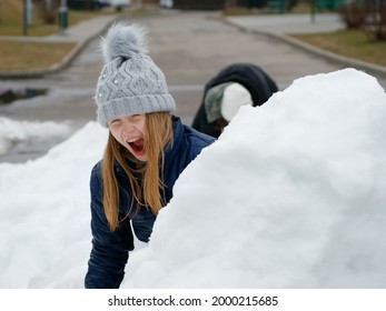 Winter Fun. Cheerful Child In A Hat Plays Snowballs 2020