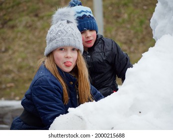 Winter Fun. Cheerful Child In A Hat Plays Snowballs 2020