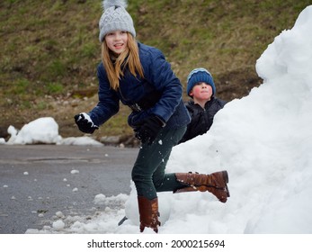 Winter Fun. Cheerful Child In A Hat Plays Snowballs 2020