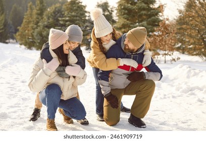 Winter fun family hugs enjoy snowy nature happiness together. Winter fun bring them closer together fostering sense of warmth and togetherness despite cold Family winter fun amidst snowy landscape - Powered by Shutterstock