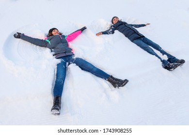 Winter Fun, Romantic Couple Makes A Snow Angel