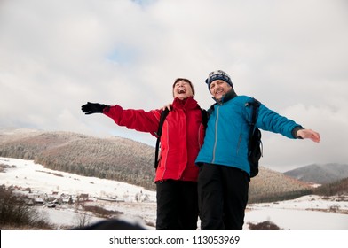 Winter Fun - Senior Retired Couple In Snow