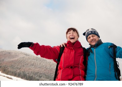 Winter Fun - Senior Retired Couple In Snow