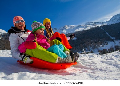 Winter Fun, Snow, Family Sledding At Winter Time