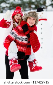 Winter Fun, Snowman -  Family Enjoying Winter