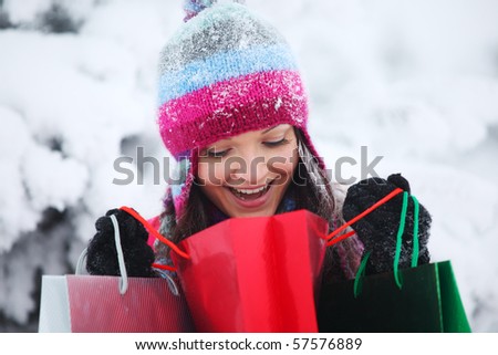 winter girl with gift bags
