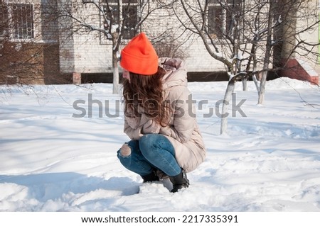 winter girl in warm hat in snow wintertime. winter fashion of girl in warm hat with wintertime snow.